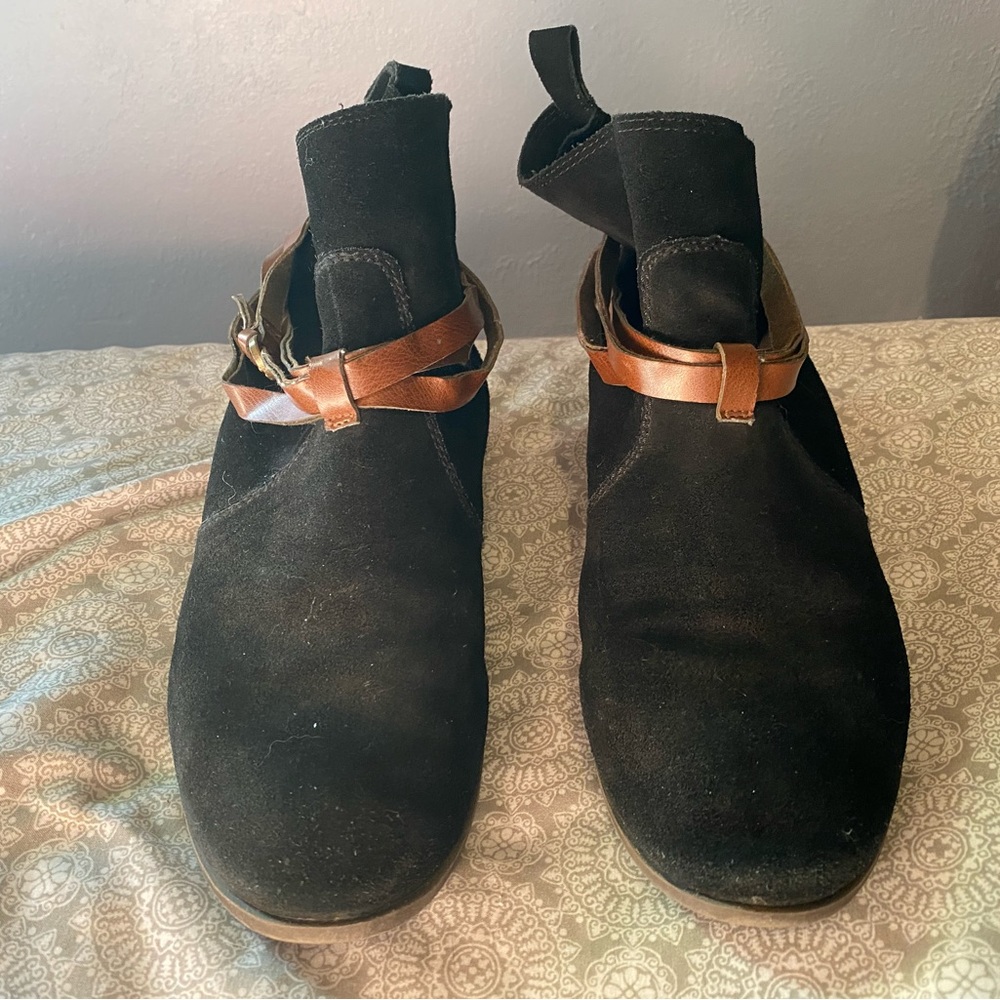 - Leather boots. Black suede with brown leather decorative straps.